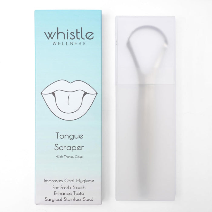 Whistle Wellness stainless steel tongue scraper in a protective case beside its box